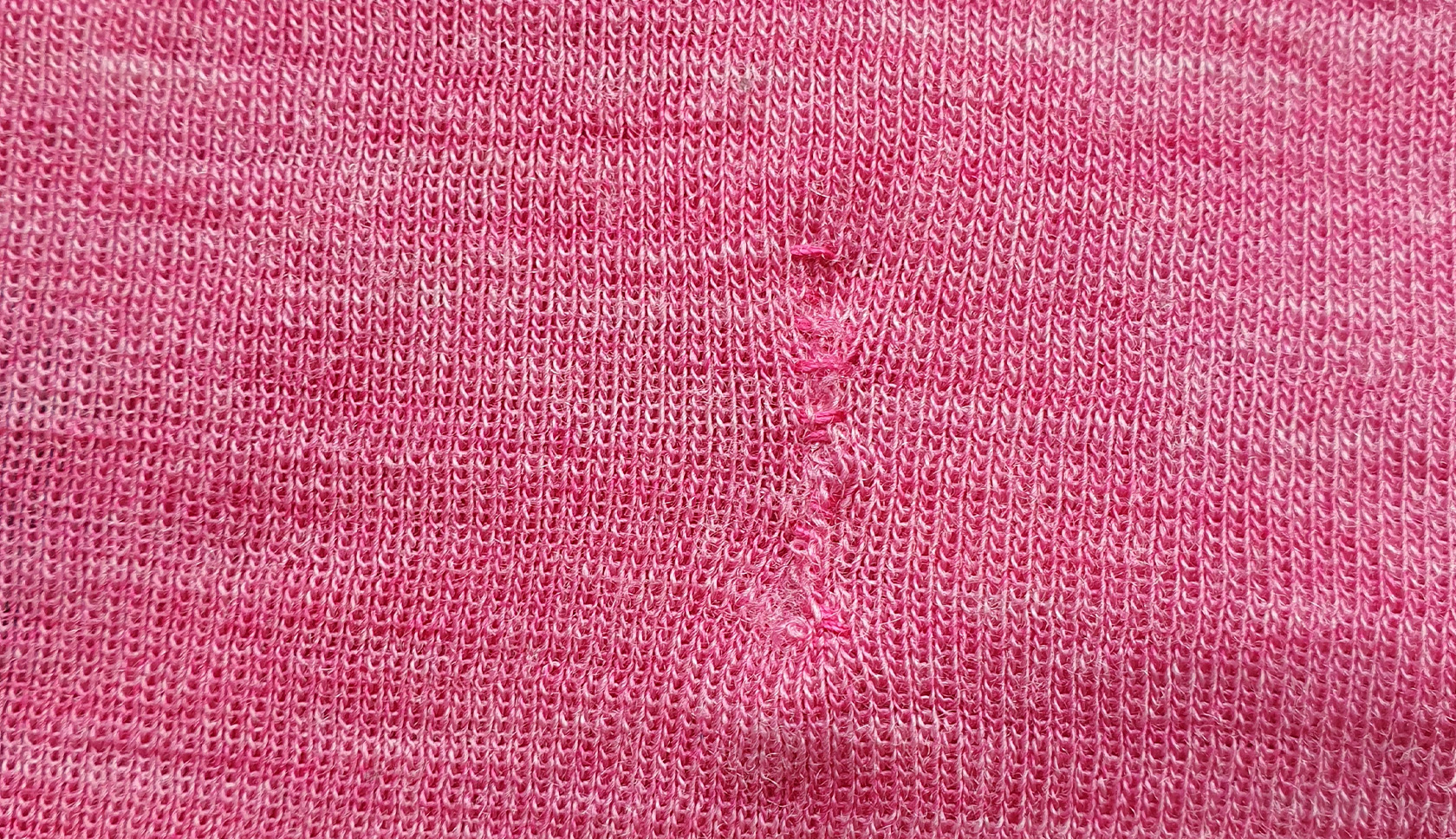 gerepareerd merinowollen kledingstuk