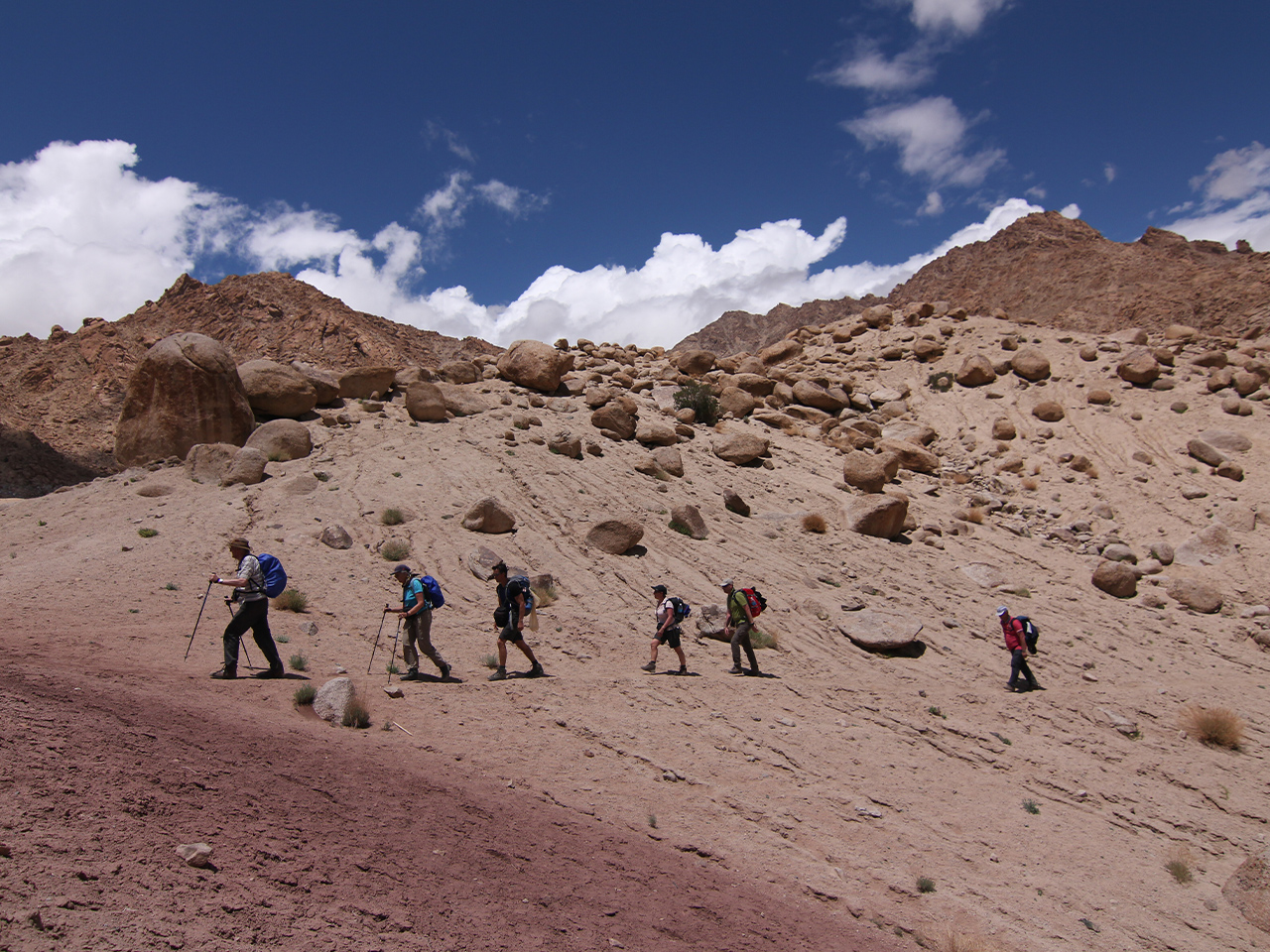 Sawadee - group of hikers in a desert